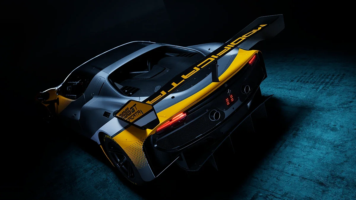 A studio-lit rear exterior view of a gray and yellow Ferrari 296 GT Modificata.