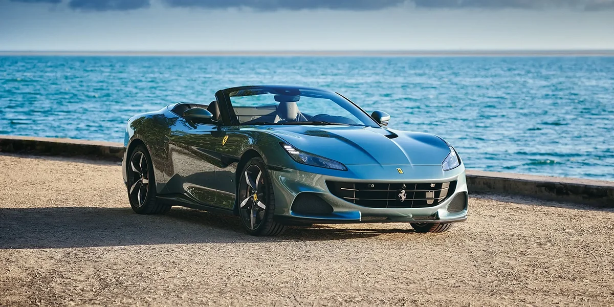 Ferrari Portofino M interior with red leather and ocean view